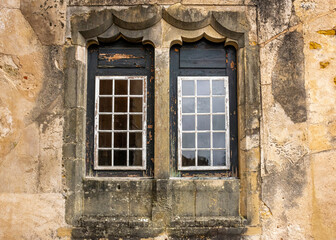 Fototapeta na wymiar Windows And Aged Composite Wall. Templar Castle/Convent Of Christ, Tomar, Portugal.