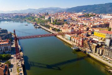 Obraz premium Aerial view of Vizcaya bridge over the river and cityscape at Portugalete, Spain