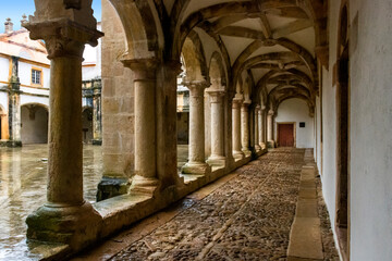 Cloister With Cobblestone Pathway, Columns and Vaulted Ceiling. Templar Castle/Convent Of Christ, Tomar, Portugal.