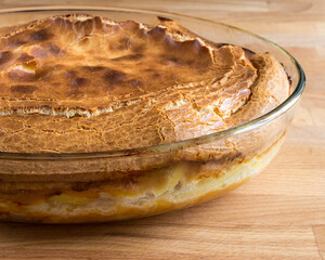 Cooked brown meat pie from the oven. No people, side view