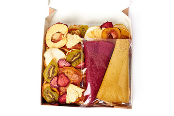 Dried fruits and fruit pastille in open craft paper box