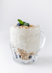 Yogurt dessert with oatmeal, blueberries, raspberry and mint