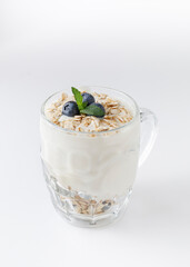 Yogurt dessert with oatmeal, blueberries, raspberry and mint