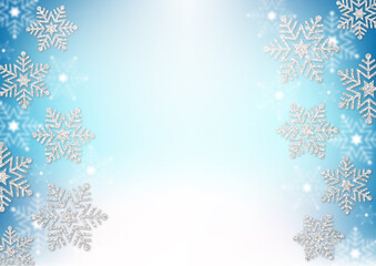 銀色のラメの雪の結晶　水色のグラデーション背景　冬のフレーム素材