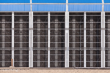 Industrial metal wall with cooling grates, texture