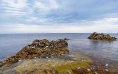 Obraz premium Azure beach with rocky mountains and clear water of Crimea at sunny day.