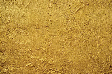 Golden wall texture rough background abstract concrete floor or Old cement grunge background with Gold empty.