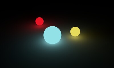 Glowing yellow,  red and blue balls on dark surface. 