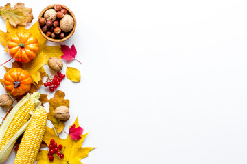 Autumn background with pumpkins, leaves and corn, top view
