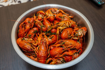 Large bowl of fresh boiled crawfish with dill from above