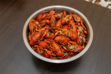 Large bowl of fresh boiled crawfish with dill from above