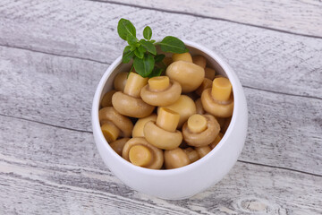 Pickled champignon heap in the bowl