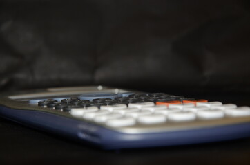 Close up of  Engineering calculator, selective focus,black background.
