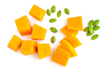 Diced Pumpkin  isolated on white background.  Pumpkin slices with seeds, top view. Flat lay.