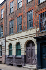 Fototapeta na wymiar London, UK, July 1, 2012 : Georgian terraced town house in Spitafields once the home of a wealthy Huguenot silk merchant and is a popular travel destination tourist attraction landmark stock photo