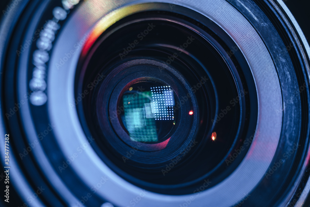 Aufkleber Close up Beautiful camera lens with multi colored light. Background pattern for design..