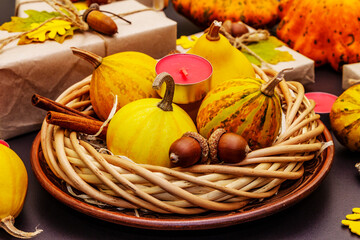 Autumn table design with crafted gift boxes, fall decor and fragrant candles