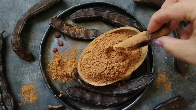 Dry carob pods and powder top view