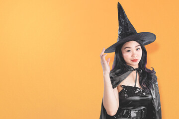 Asian witch woman with a hat standing