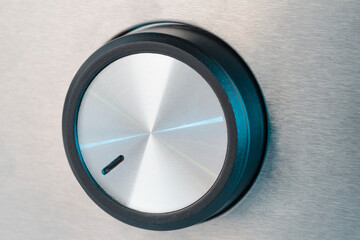 Black color Round switch, regulator with silver pattern, close up