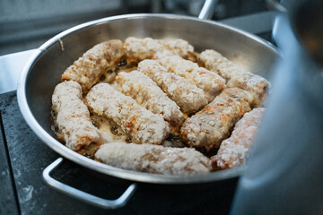 Fast food. Stuffed cutlets are fried in oil on the stove