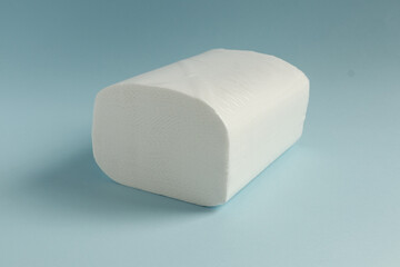 White paper napkins on color background