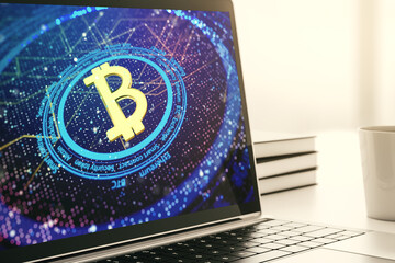Modern computer display with creative Bitcoin symbol hologram. Mining and blockchain concept. 3D Rendering