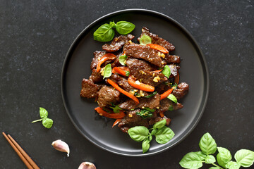 Thai style stir-fry beef with vegetables on plate