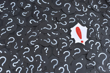 Exclamation mark on a question mark background. Concept of decision, faq, q&a and riddle