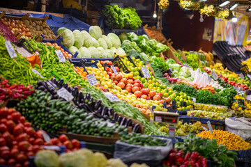 Colorful view of greengrocery counter with several fruits and vegetables