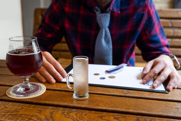 Alcoholism concept. Unemployed man in a bar. Fight against alcohol addiction, drug addiction, depression.