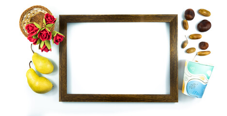 Decorative photo autumn attributes, flowers, harvest and wooden frame on white isolated background