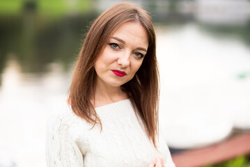 Portrait girl on nature background in the light of the day.