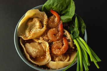 Shrimp noodle soup with wontons and spinach