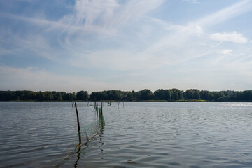 Beautiful sunset scenery of a fishing net in a lake one of the latest days of summer. Picture from Ringsjon, Scania, Sweden. 