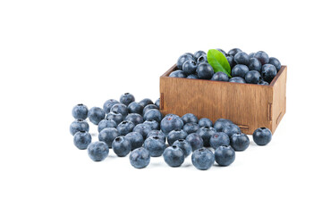 blueberries in a wooden box on a white background