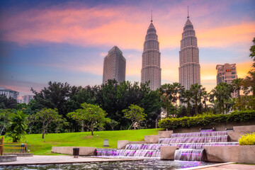 Landscape view of Kuala Lumpur skyscraper with colorful sunset sky, Malaysia..