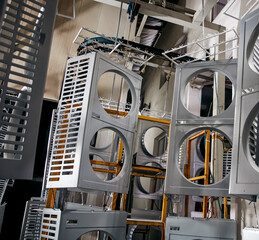 Large-scale factories automatically push the raw materials of stainless steel on the flowing water, one process after another