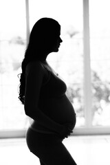 beautiful young pregnant woman, black and white photo