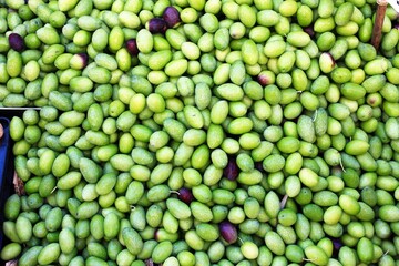 Stall with green olives at street market in Athens, Greece.