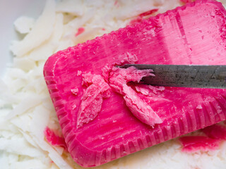 ASMR concept. Cut soap with a clerical knife. Relaxation method.