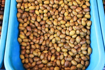 Stall with Kalamata or Kalamon olives at street market in Athens, Greece.
