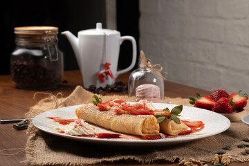 Crepes with strawberries and cream