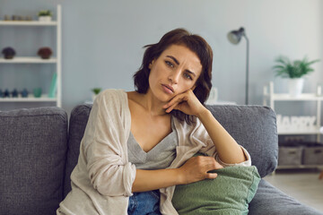 Obraz premium Young woman listening to somebody during online meeting