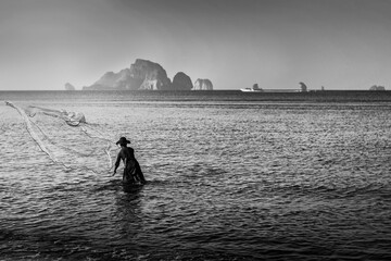 Fisher man fishing in the sea beach countryside