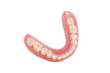 Dentures lie on a white background, upper and lower jaw, top view. Dental prosthetics, the photo.