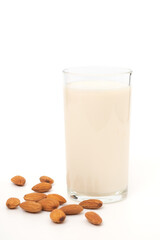 Almond milk with almond seeds isolated on white background, Health drink concept, for vegan food or vegetarian eat