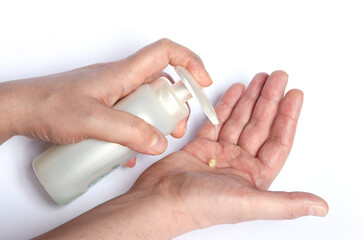 man washes his hands with soap to protect himself from the corona virus (COVIT-19) and bacteria, washing his hands with soap on a white background.