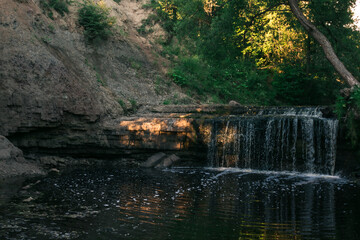 Summer landscape with small waterfall