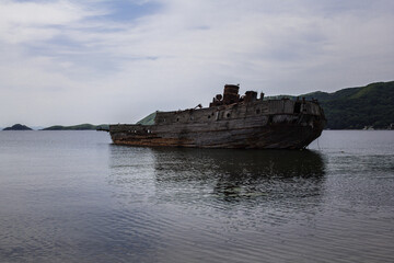 Landscape with old wooden ship